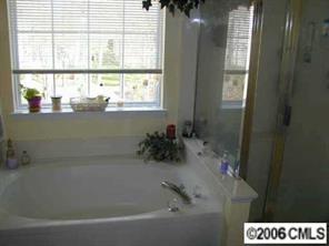 6617 Reedy Creek Road Charlotte, NC 28215 - Photo 7 of 8 a bath tub sitting next to a window