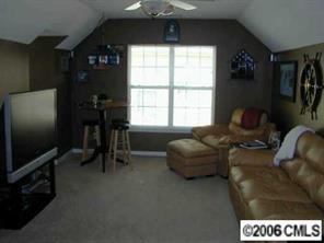 6617 Reedy Creek Road Charlotte, NC 28215 - Photo 8 of 8 a living room with furniture and a flat screen tv