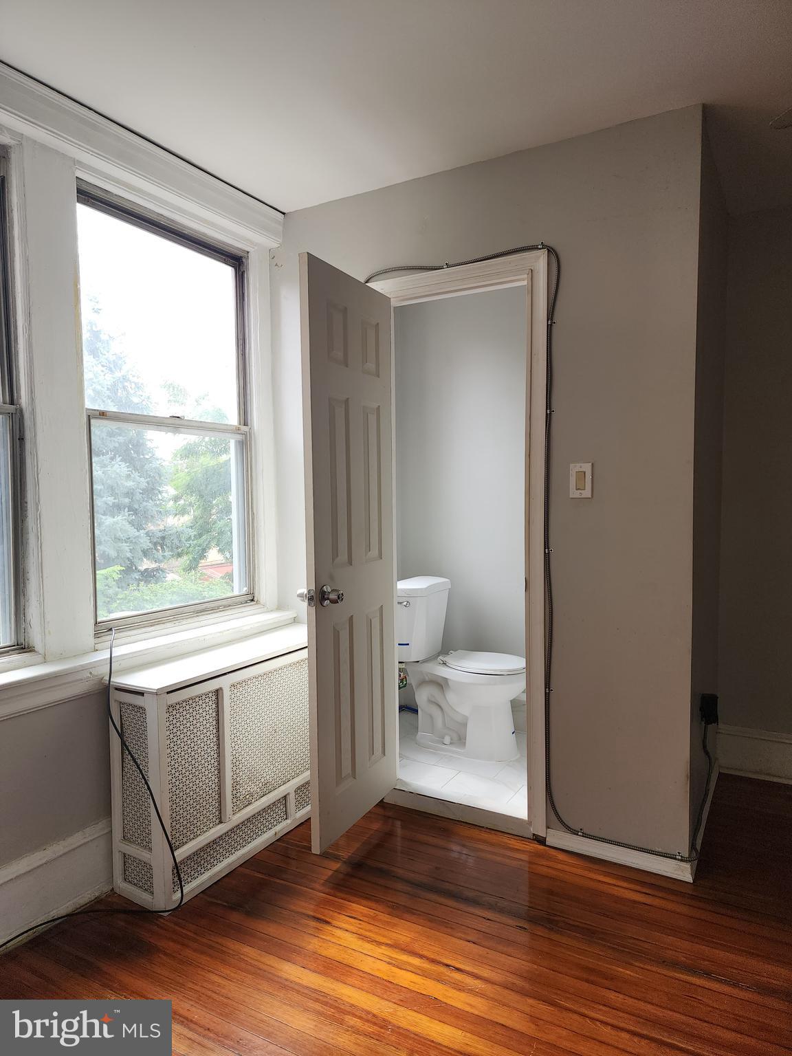 217 South 47th Street, Unit 2 Philadelphia, PA 19139 - Photo 14 of 22 a view of an empty room and window
