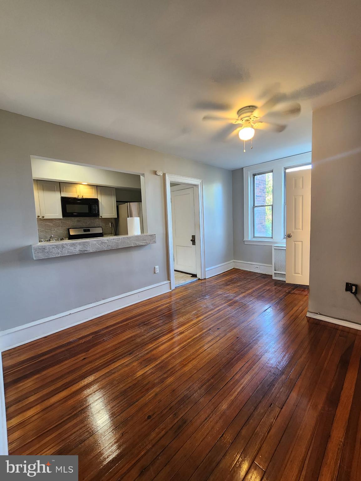 217 South 47th Street, Unit 2 Philadelphia, PA 19139 - Photo 22 of 22 a view of a room with wooden floor and window