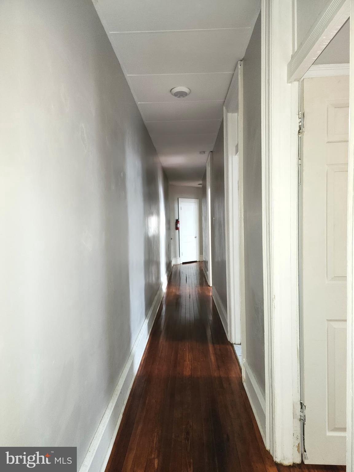 217 South 47th Street, Unit 2 Philadelphia, PA 19139 - Photo 5 of 22 a view of a hallway with wooden floor