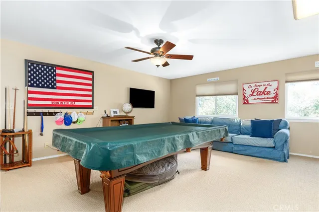 a living room with furniture and flat screen tv