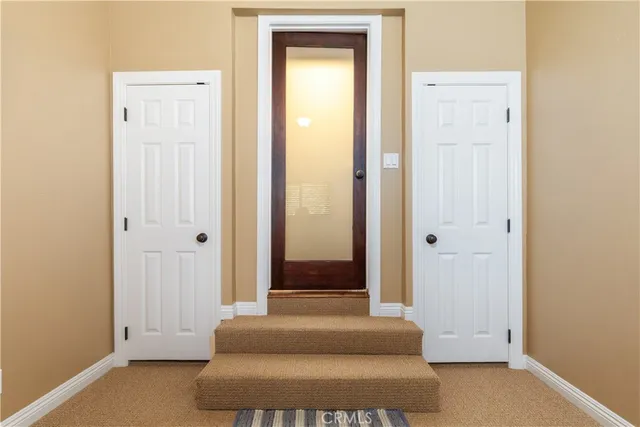 a bedroom with a bed and flat screen tv