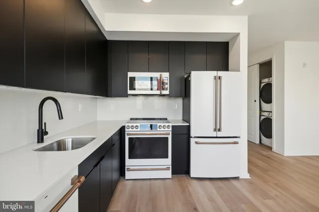 a view of a hallway with wooden floor and a window