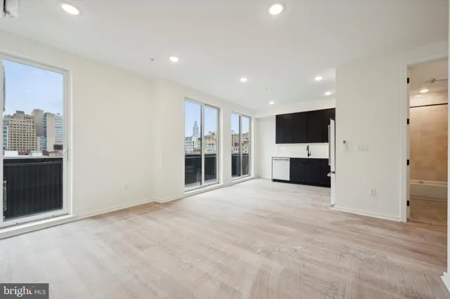 a view of empty room with a flat screen tv