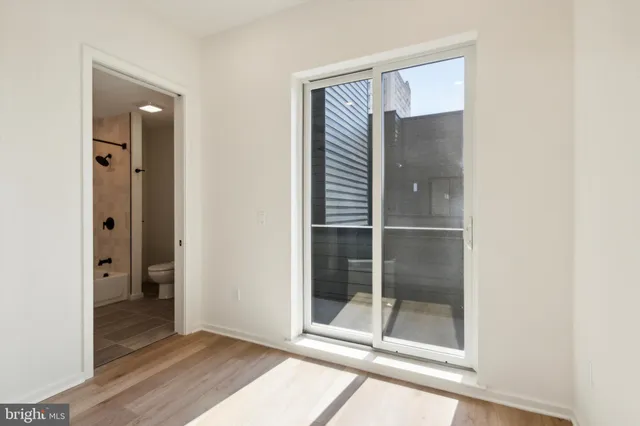 a bathroom with a granite countertop toilet a sink and bathtub