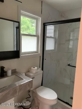 a bedroom with two beds and a mirror