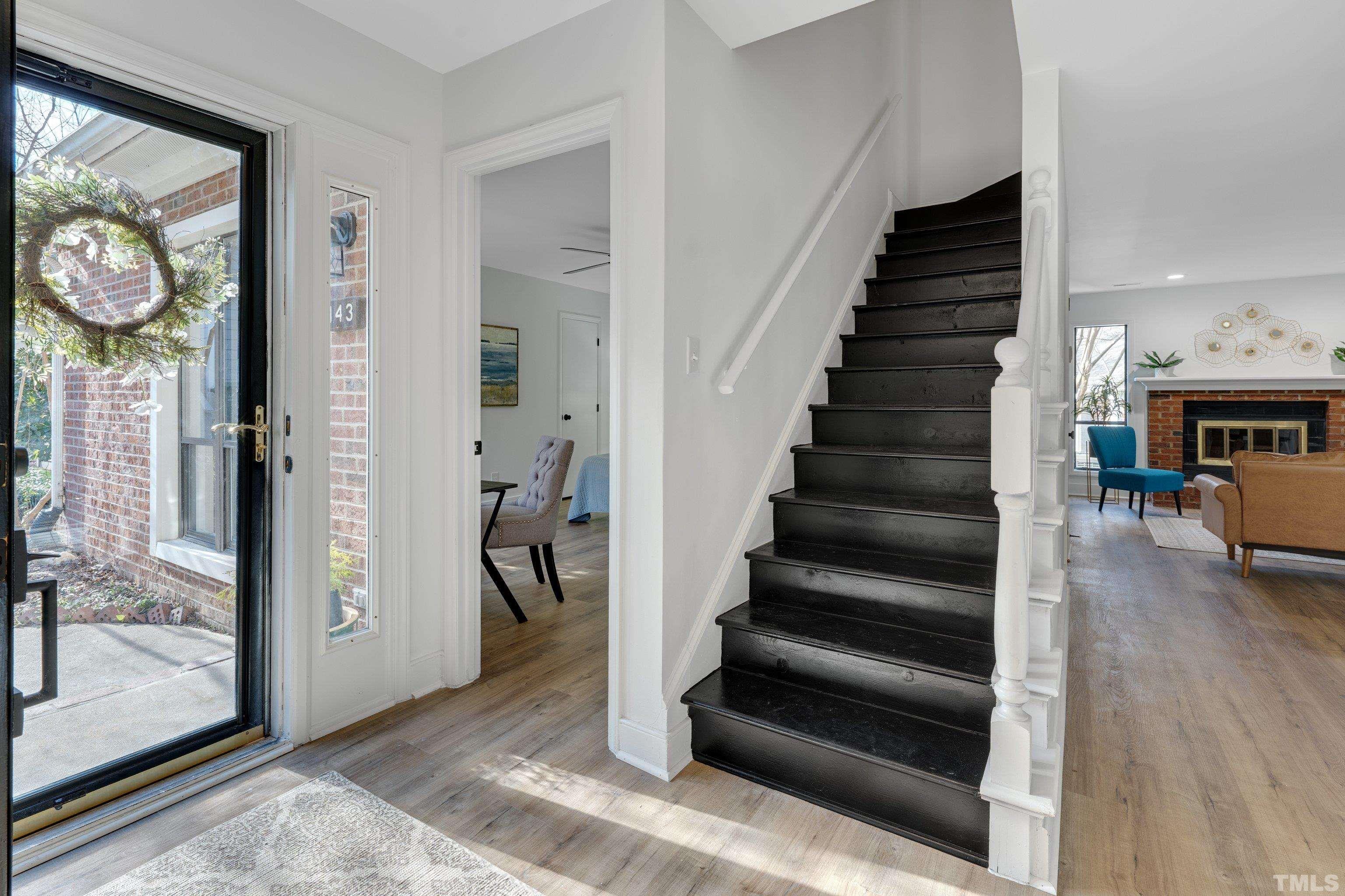 143 Clancy Circle Cary, NC 27511 - Photo 4 of 24 a view of entryway and hall with wooden floor