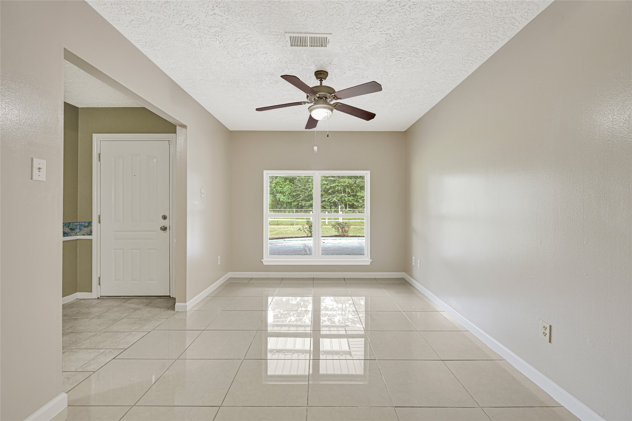 20135 Timber Line Lane New Caney, TX 77357 - Photo 7 of 30 a view of an empty room with a window