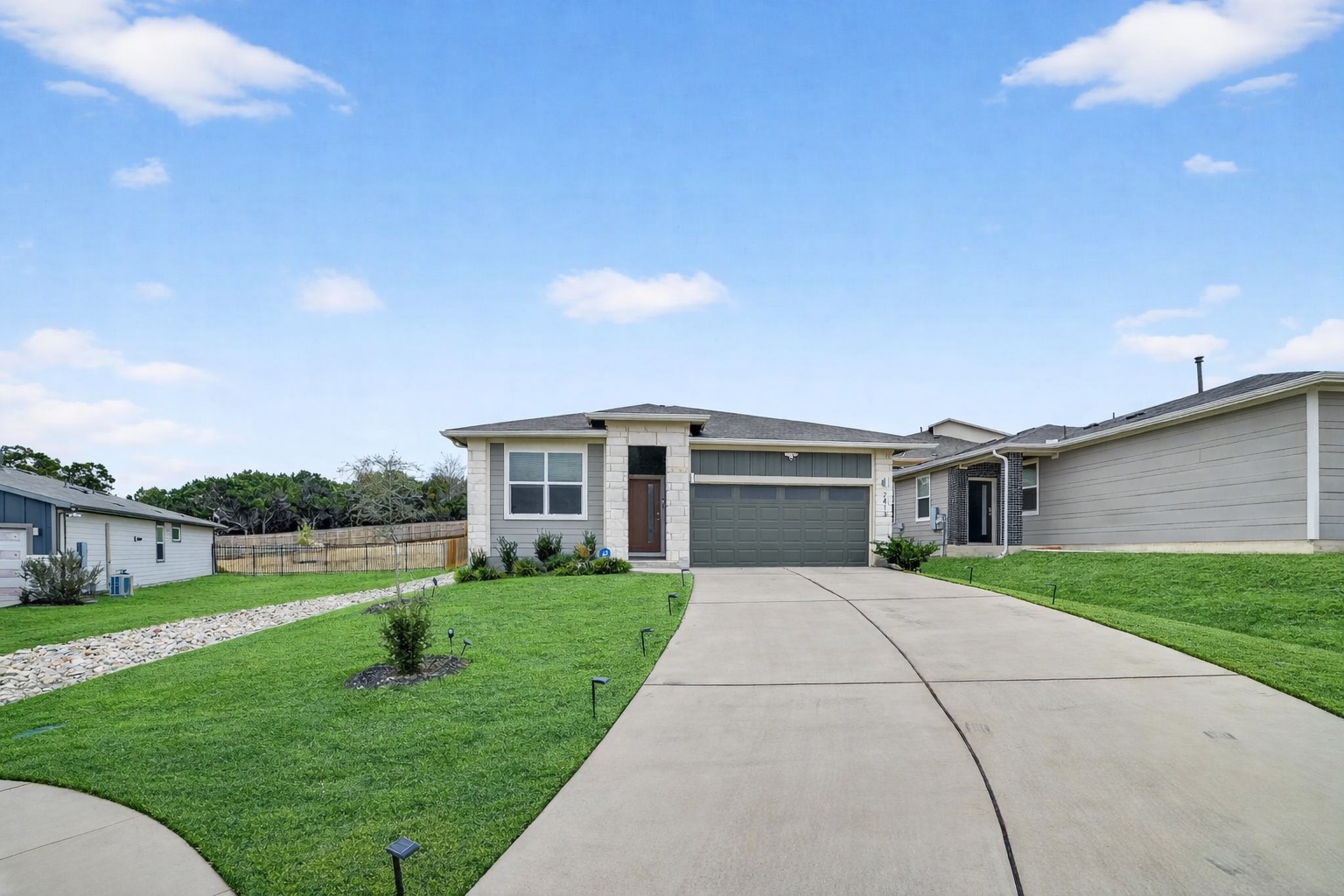 Prairie-style home with driveway and an attached garage