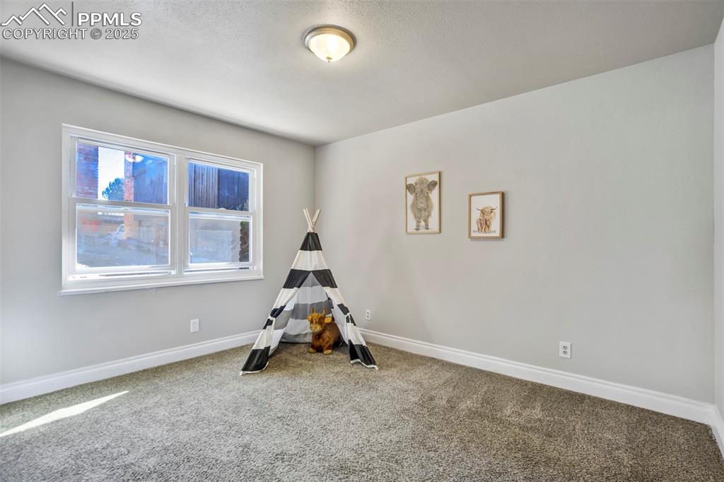 2902 Airport Road, Unit 116 Colorado Springs, CO 80910 - Photo 19 of 32 a view of a room with gym equipment and a window