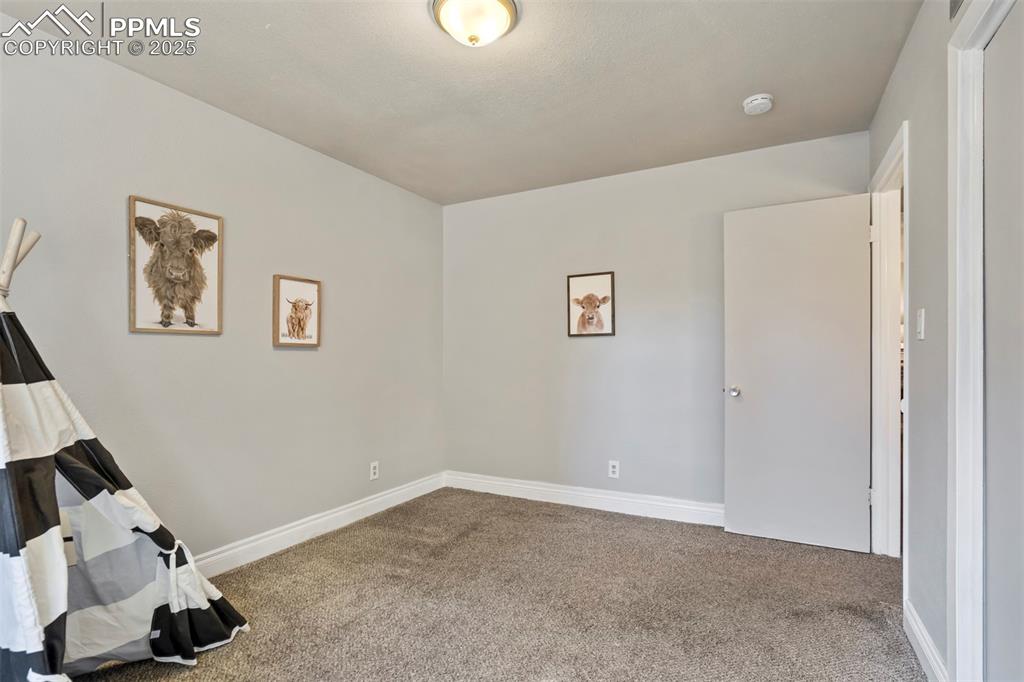 2902 Airport Road, Unit 116 Colorado Springs, CO 80910 - Photo 20 of 32 a view of a livingroom with wooden floor and a window