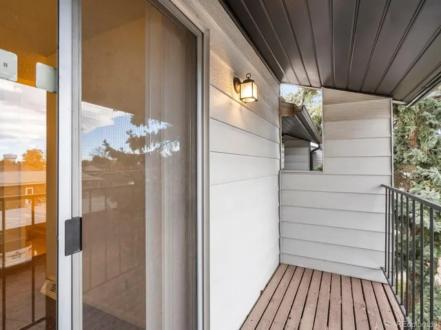 a view of balcony with wooden floor