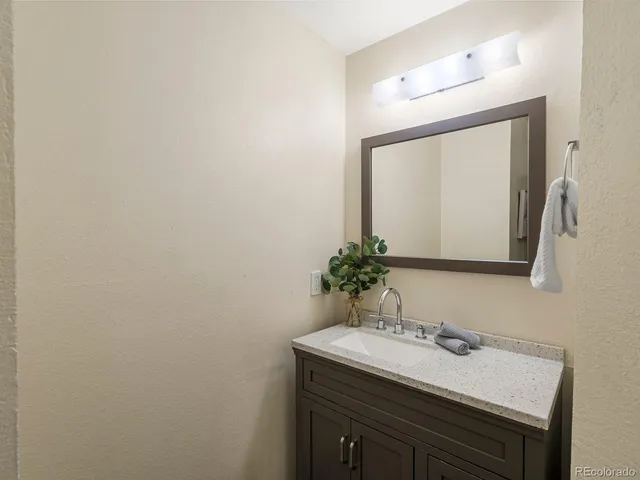 a white toilet sitting next to a bath tub and a shower