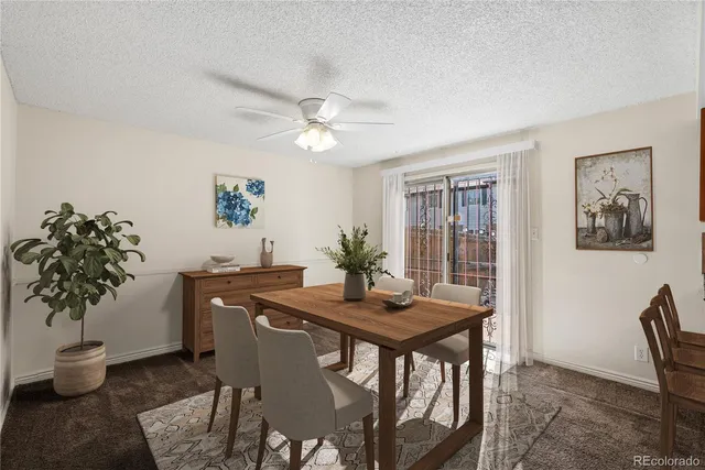 a view of a kitchen with a stove cabinets and a ceiling fan