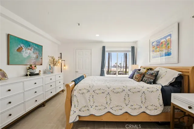 a bedroom with bed and window