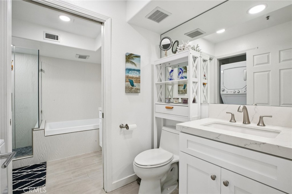 200 Pacific Coast Highway, Unit 130 Huntington Beach, CA 92648 - Photo 20 of 36 a bathroom with a sink toilet and shower