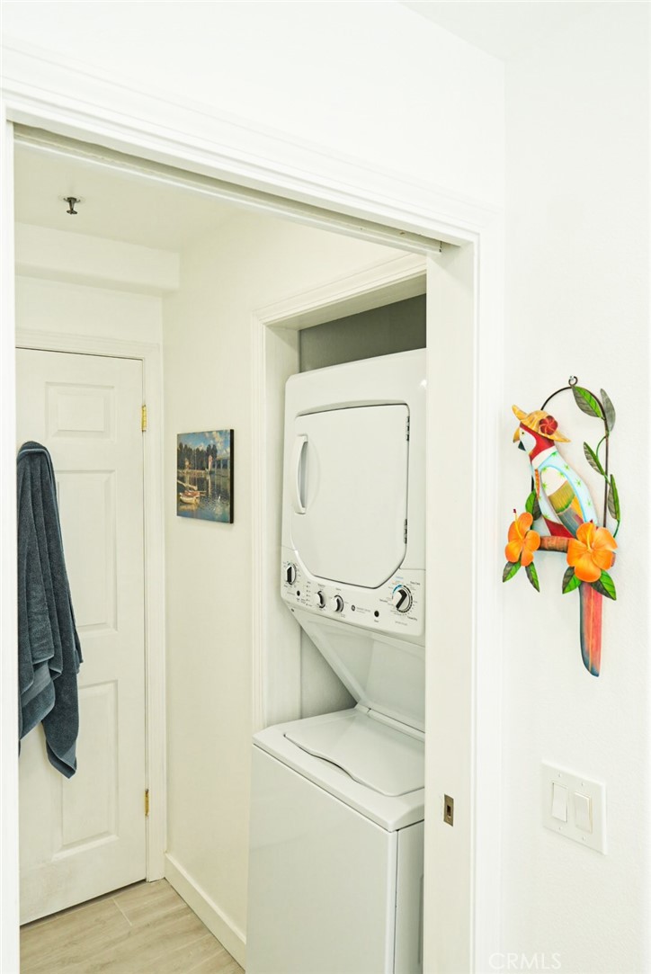 200 Pacific Coast Highway, Unit 130 Huntington Beach, CA 92648 - Photo 21 of 36 a utility room with dryer and washer