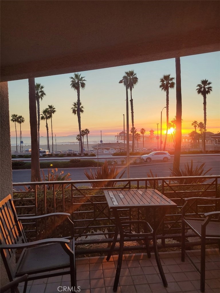 200 Pacific Coast Highway, Unit 130 Huntington Beach, CA 92648 - Photo 33 of 36 a view of a balcony with table and chairs