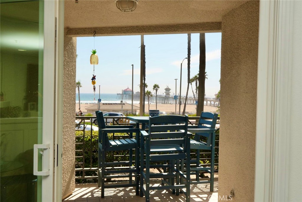 200 Pacific Coast Highway, Unit 130 Huntington Beach, CA 92648 - Photo 4 of 36 a view of a balcony with chairs