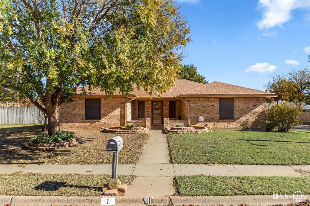 Ranch-style home with roof with shingles, brick siding, and a porch