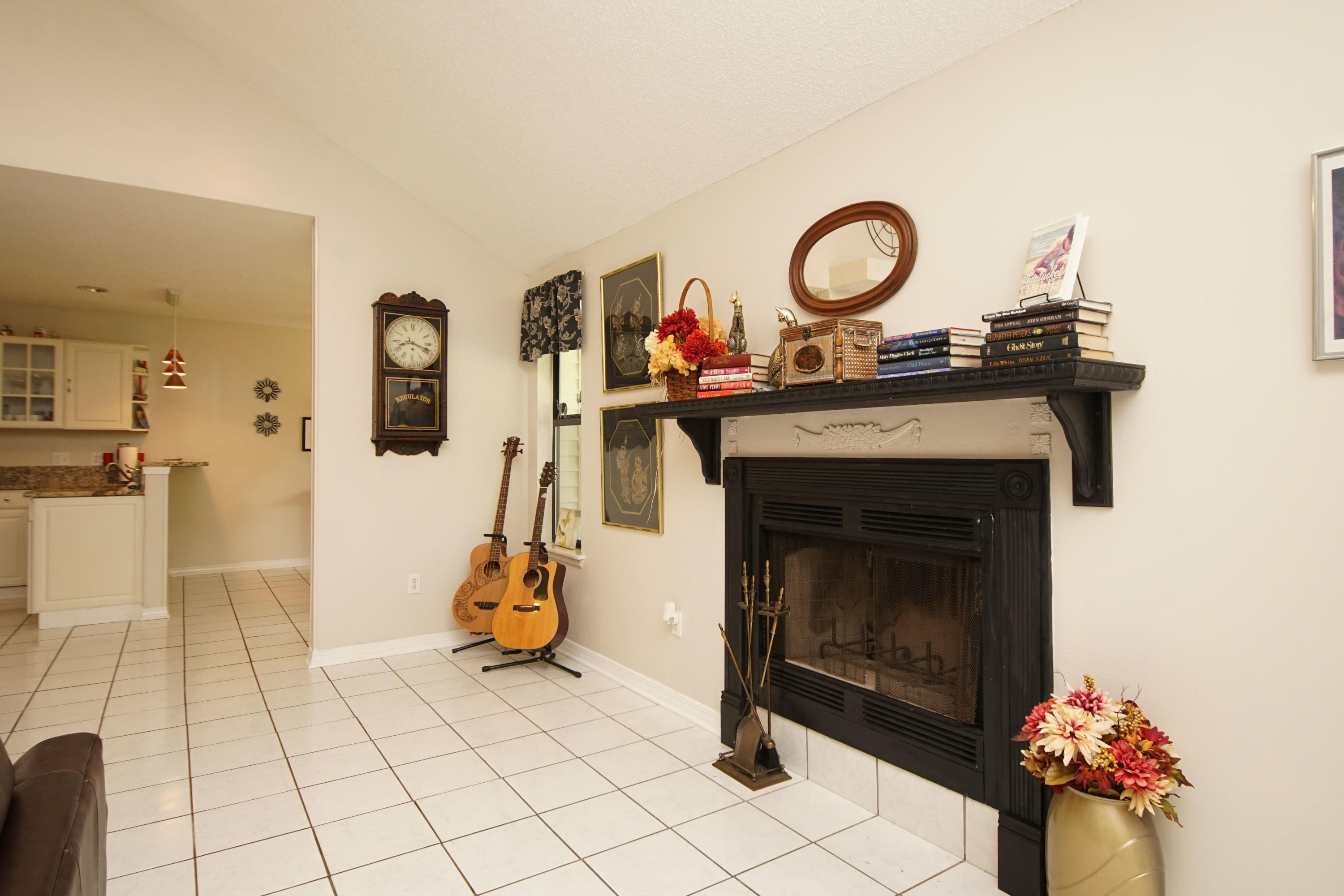 2388 Crescent Road Navarre, FL 32566 - Photo 22 of 55 a living room with furniture and a fireplace