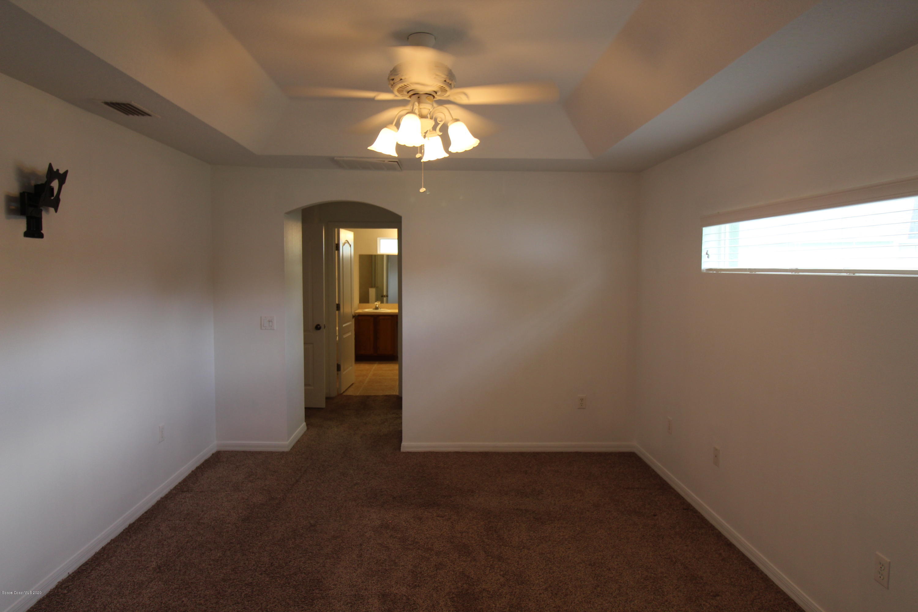 2004 Gloria Circle Palm Bay, FL 32905 - Photo 14 of 36 a view of a livingroom with a chandelier