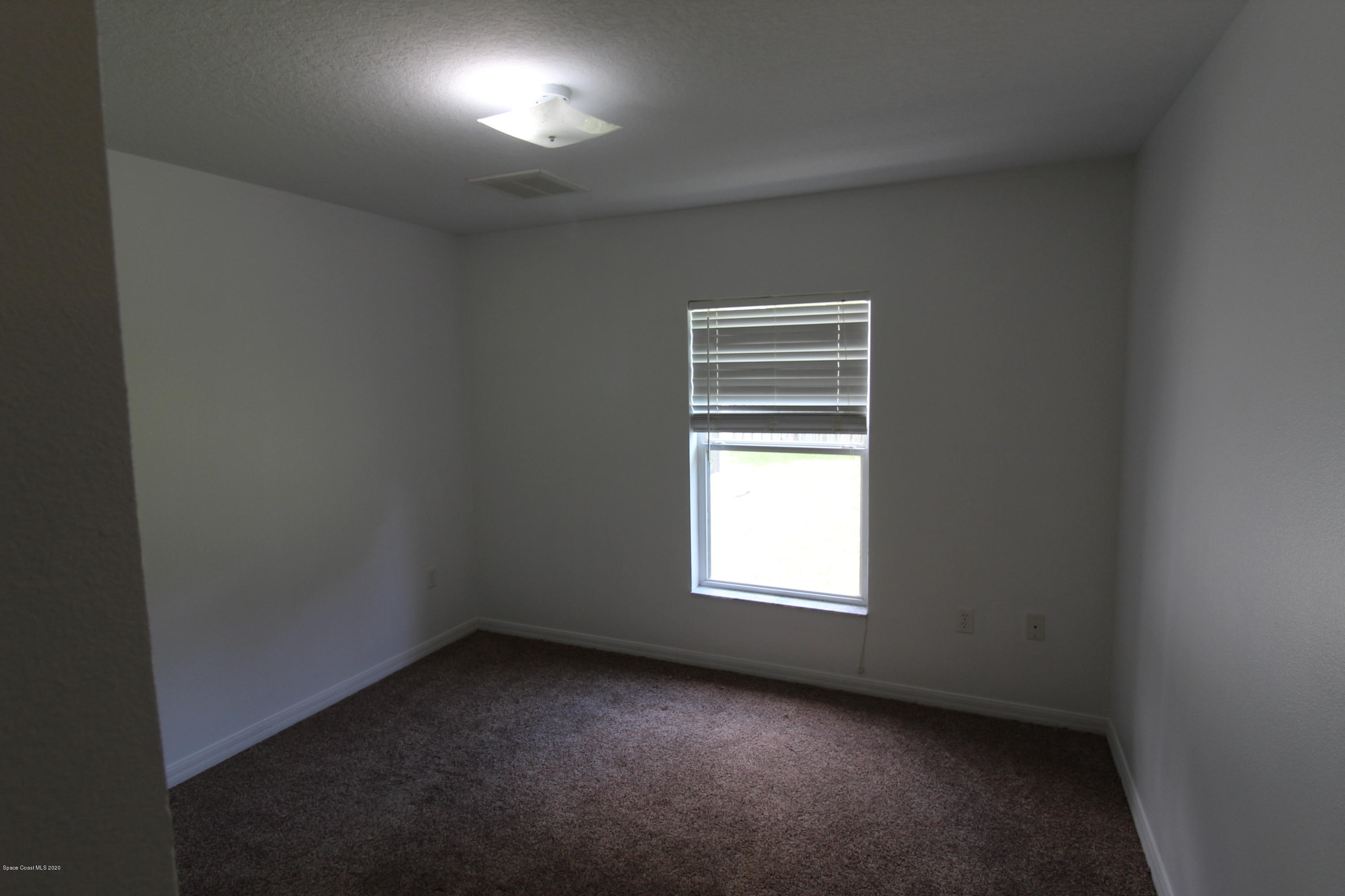 2004 Gloria Circle Palm Bay, FL 32905 - Photo 23 of 36 an empty room with a window