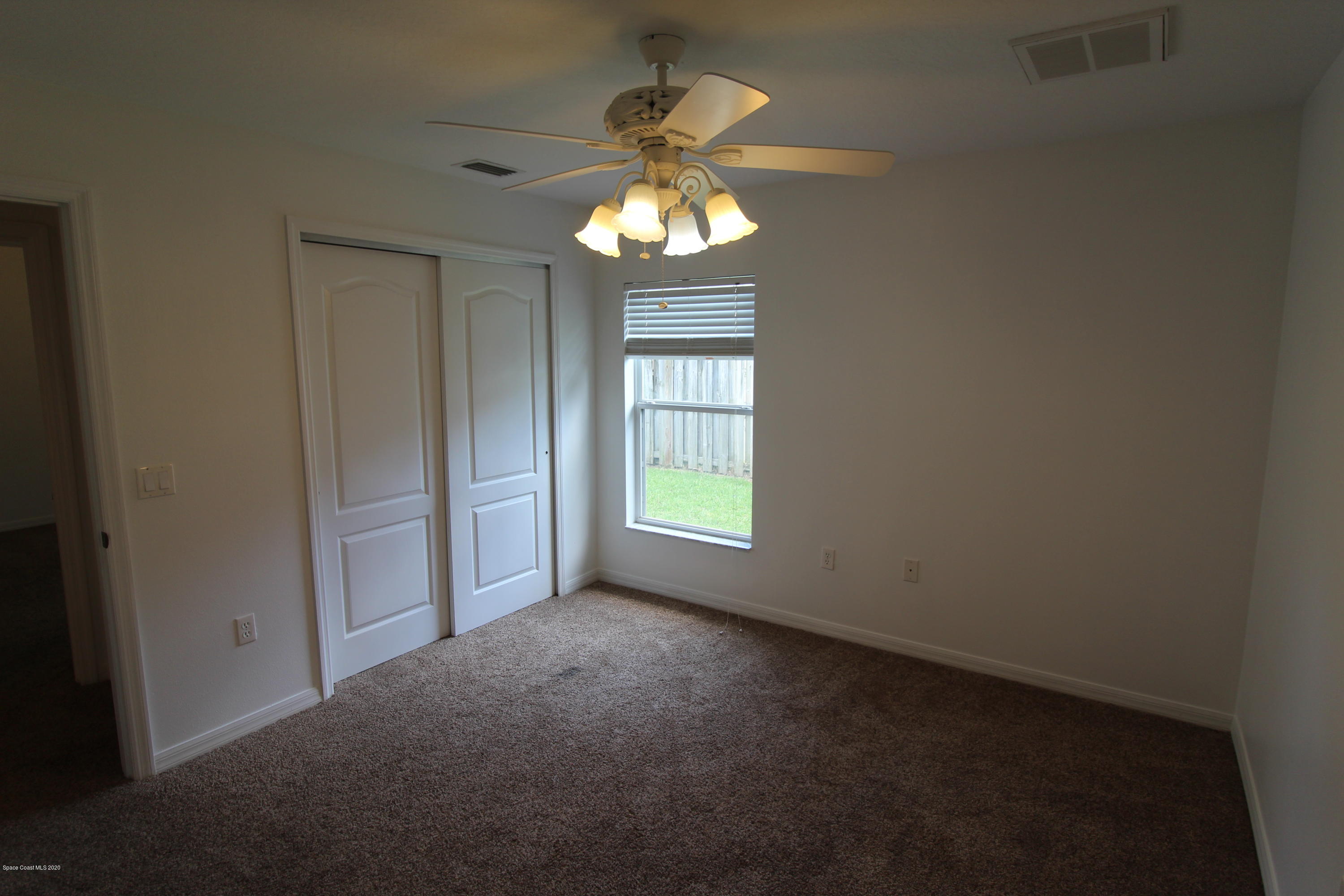 2004 Gloria Circle Palm Bay, FL 32905 - Photo 25 of 36 a view of an empty room with a window