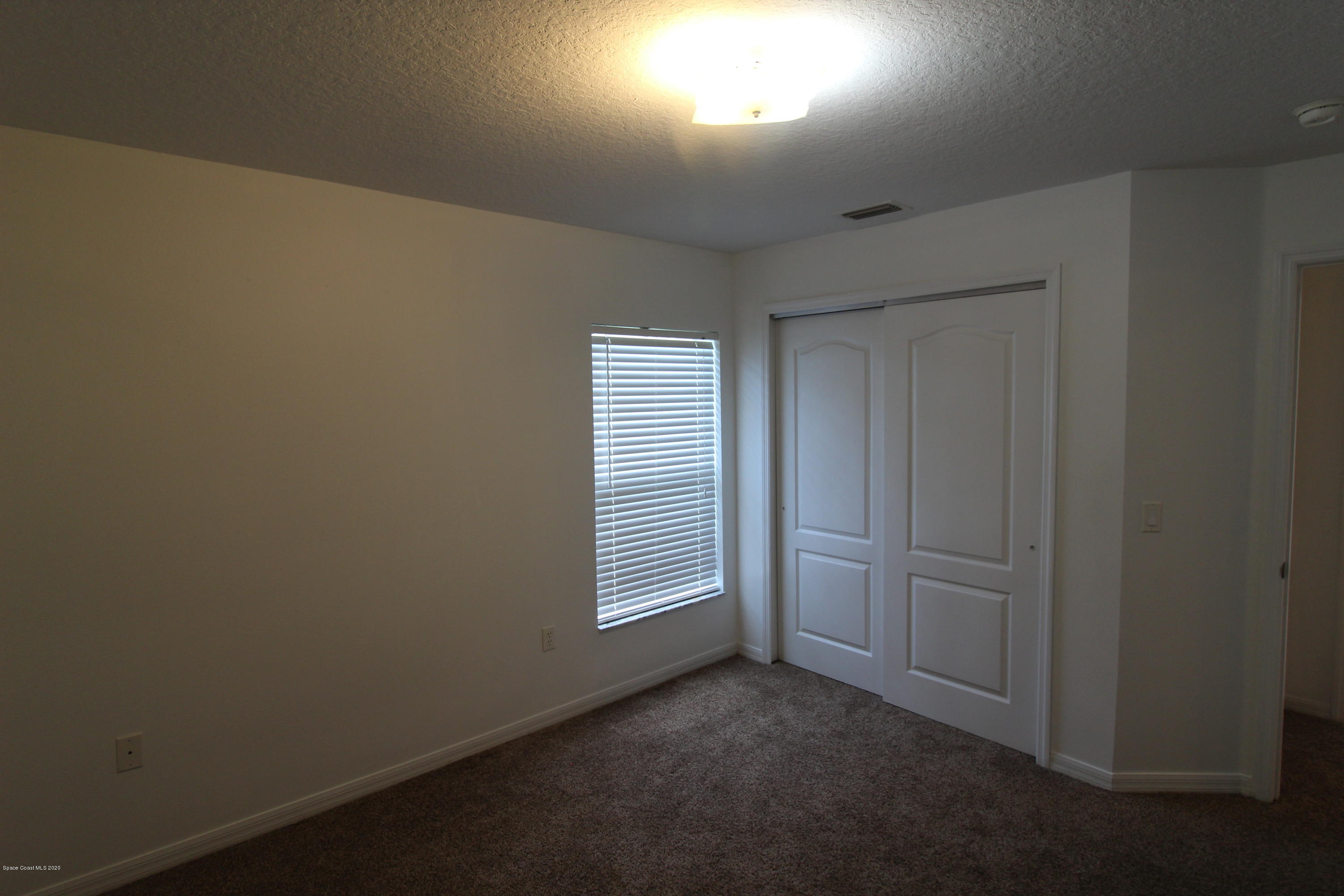 2004 Gloria Circle Palm Bay, FL 32905 - Photo 27 of 36 an empty room with windows