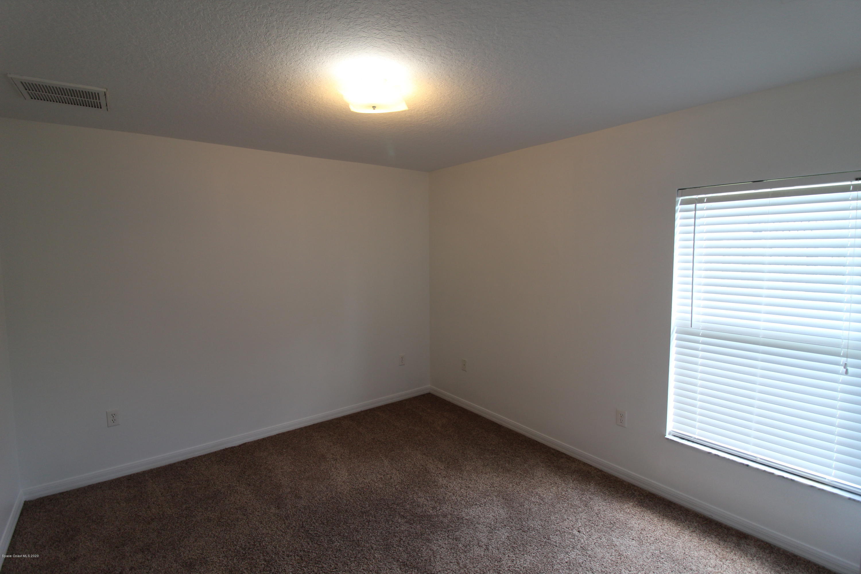 2004 Gloria Circle Palm Bay, FL 32905 - Photo 28 of 36 an empty room with a window
