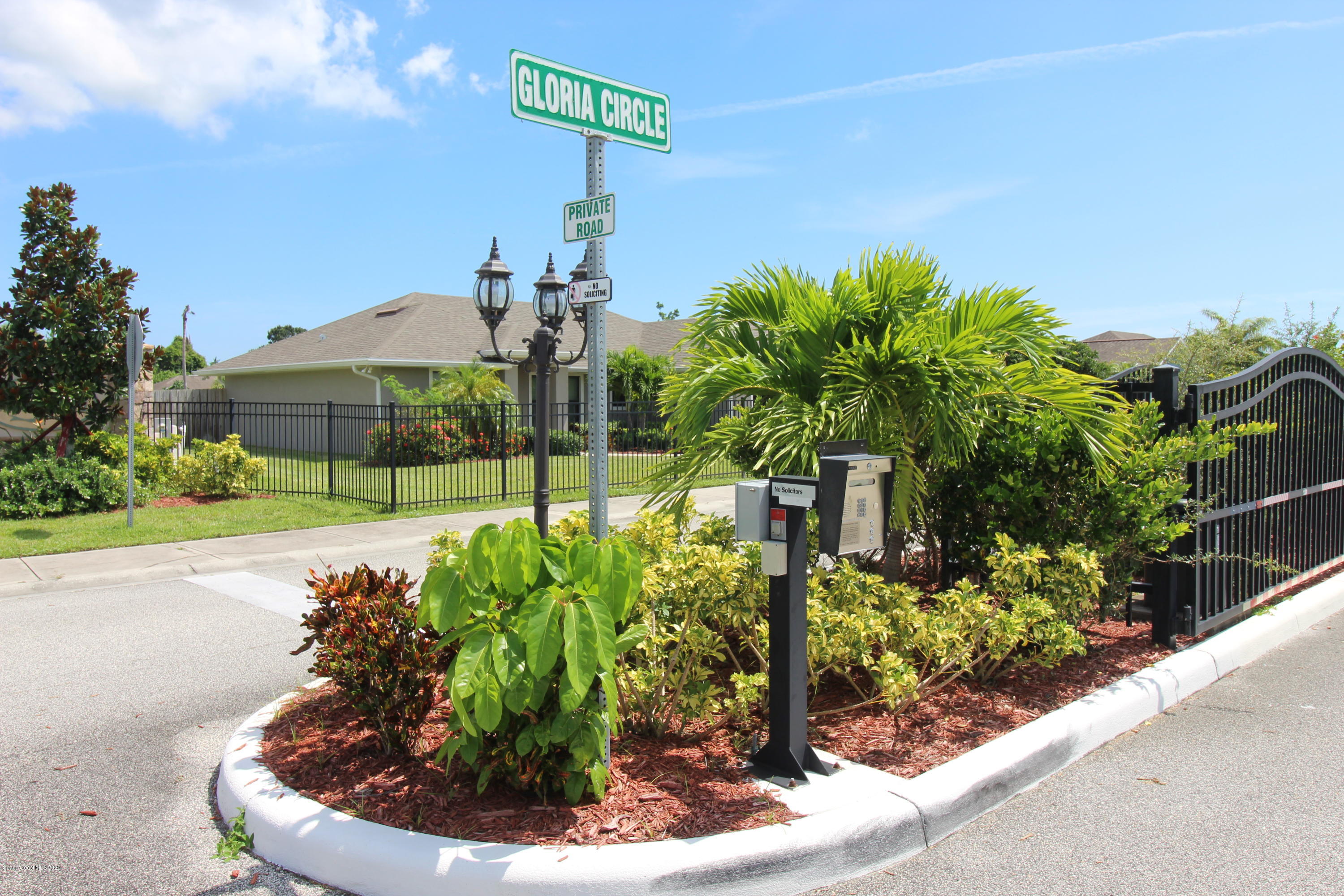 2004 Gloria Circle Palm Bay, FL 32905 - Photo 4 of 36 a view of a house with a yard and potted plants