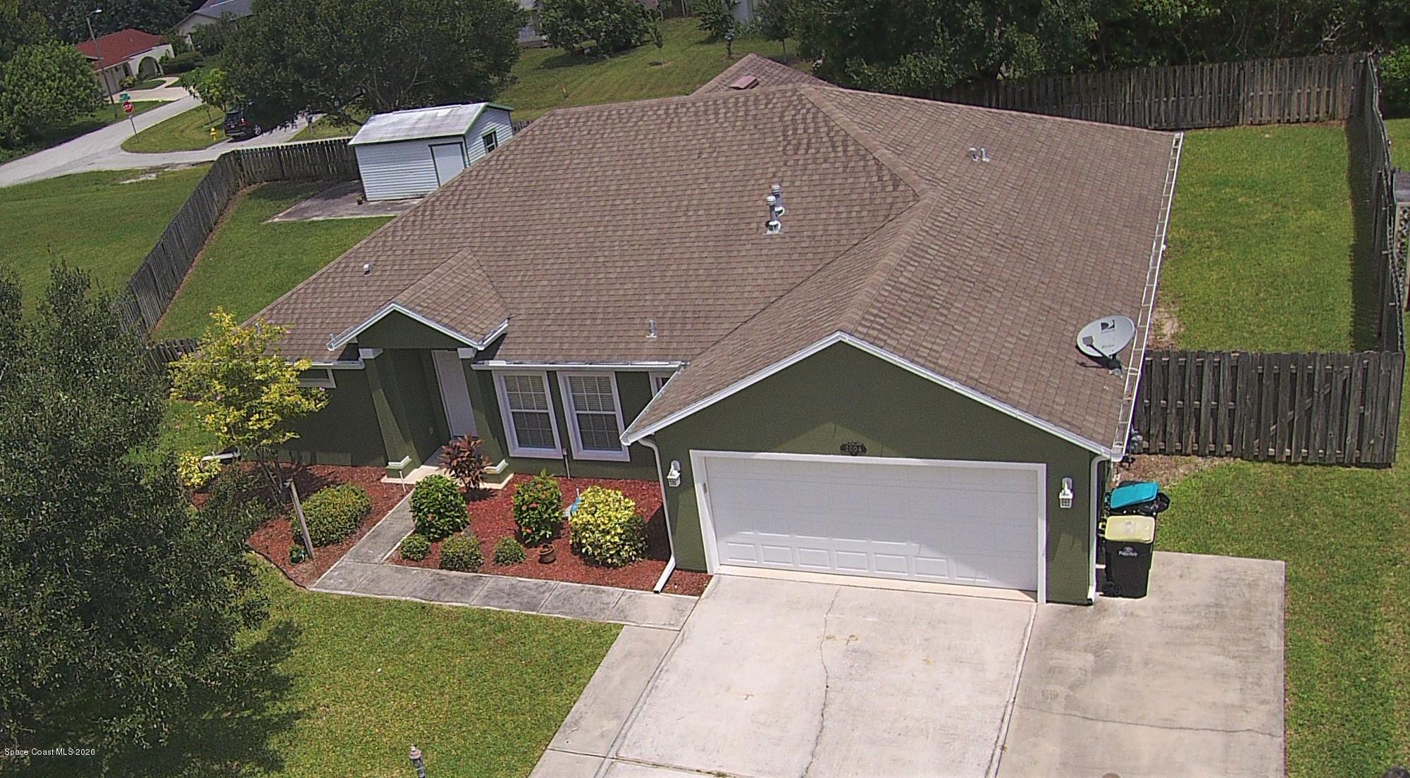 2004 Gloria Circle Palm Bay, FL 32905 - Photo 32 of 36 a aerial view of a house with a yard and a sitting area