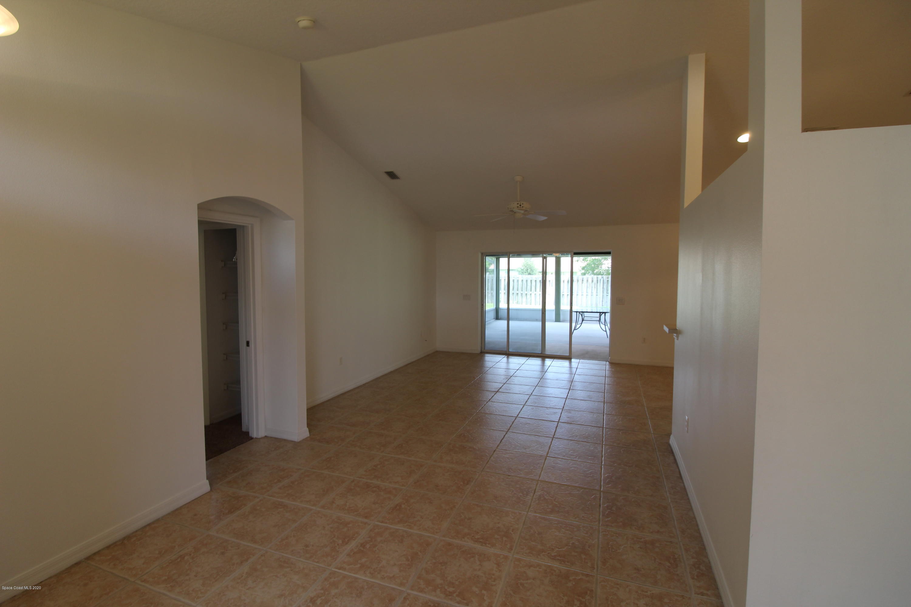 2004 Gloria Circle Palm Bay, FL 32905 - Photo 8 of 36 a view of a hallway with wooden floor and windows