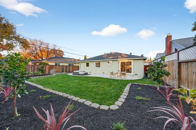 a view of a house with a back yard