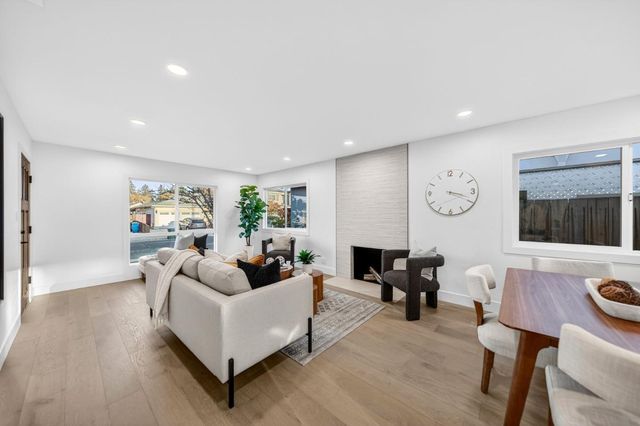 a living room with furniture and window