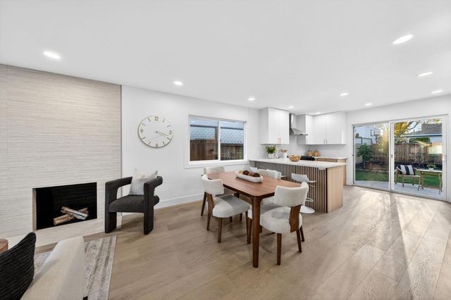 a kitchen with a table and chairs in it