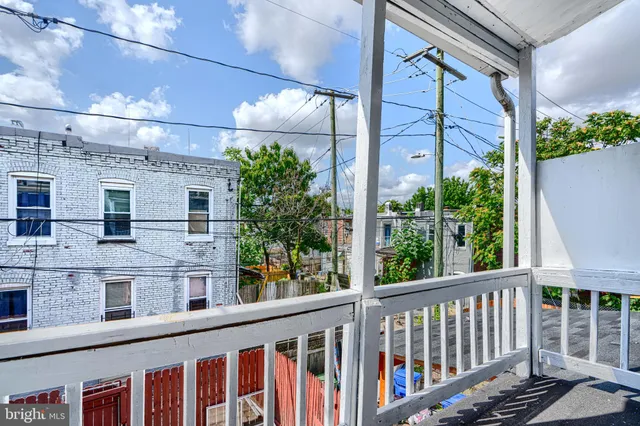 a view of a brick building from a balcony