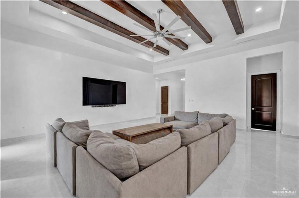 1105 Wesley Street Pharr, TX 78577 - Photo 3 of 17 a living room with furniture and a flat screen tv