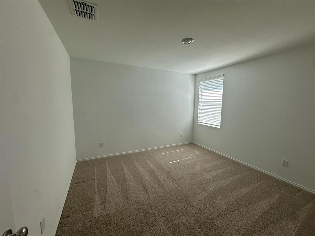3210 Normandy Brk Road Dallas, TX 75212 - Photo 4 of 9 an empty room with a window
