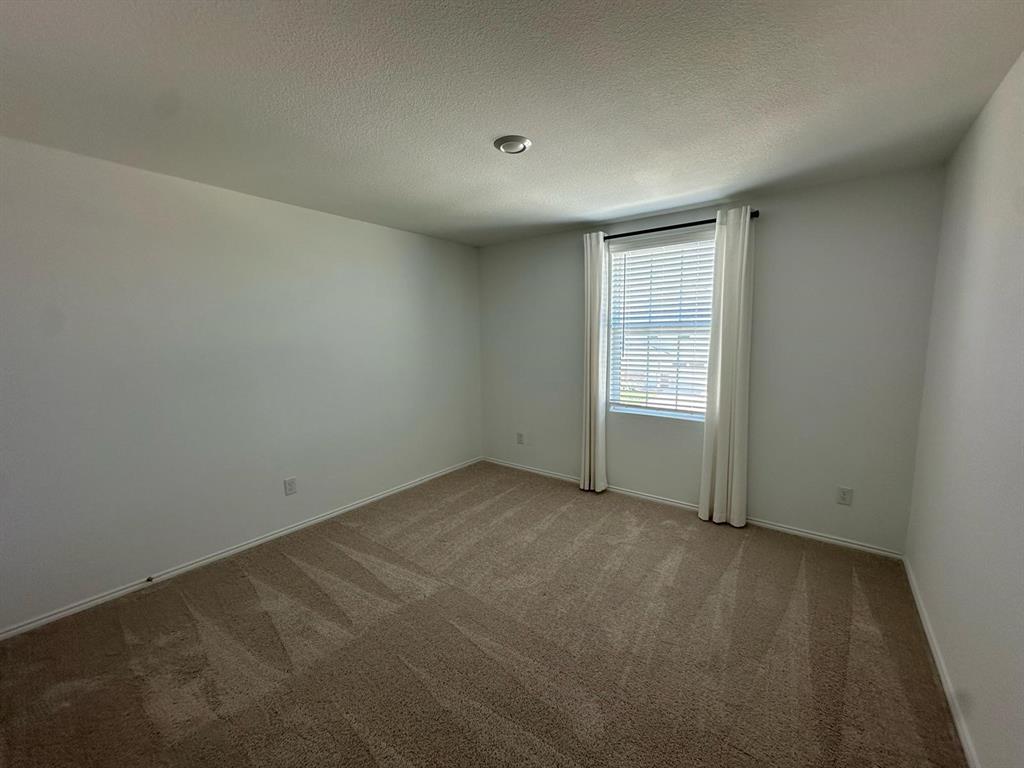 3210 Normandy Brk Road Dallas, TX 75212 - Photo 5 of 9 an empty room with windows