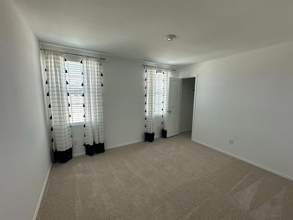 3210 Normandy Brk Road Dallas, TX 75212 - Photo 6 of 9 an empty room with windows