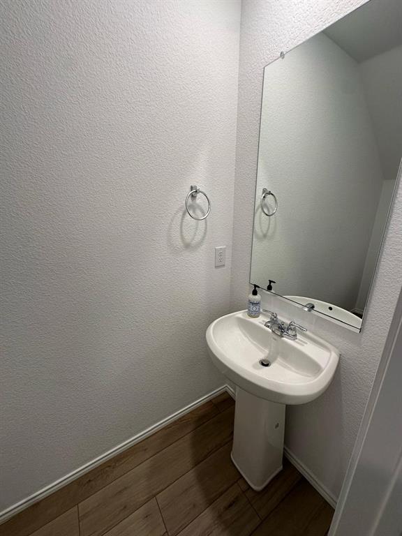 3210 Normandy Brk Road Dallas, TX 75212 - Photo 9 of 9 a bathroom with a sink a mirror and toilet