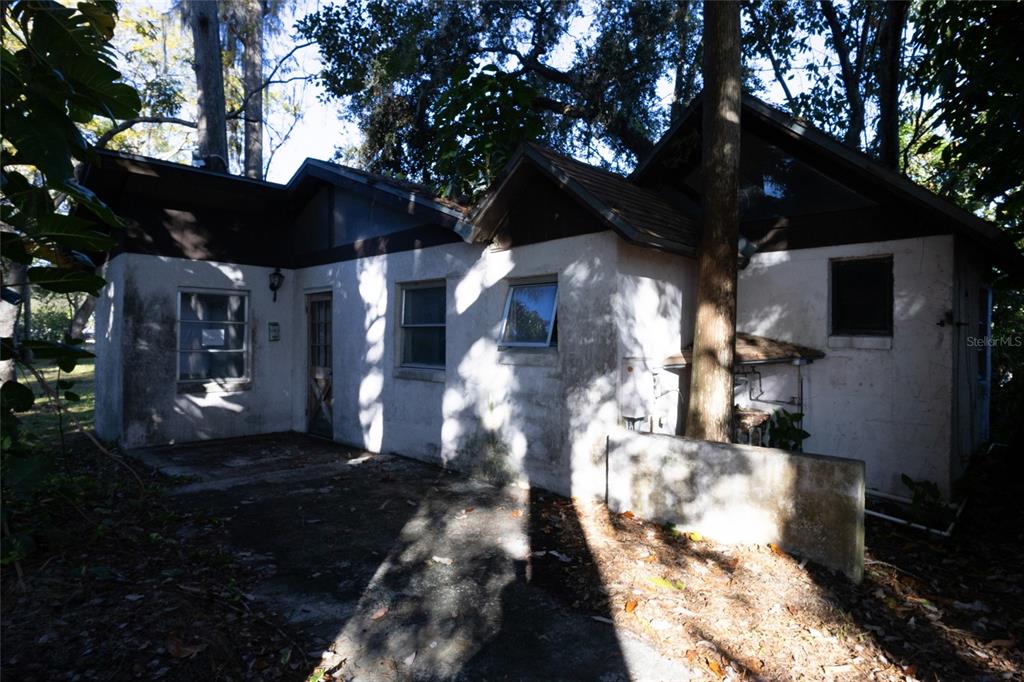 4711 Rio Grande Avenue Orlando, FL 32839 - Photo 12 of 38 a view of yard along with trees
