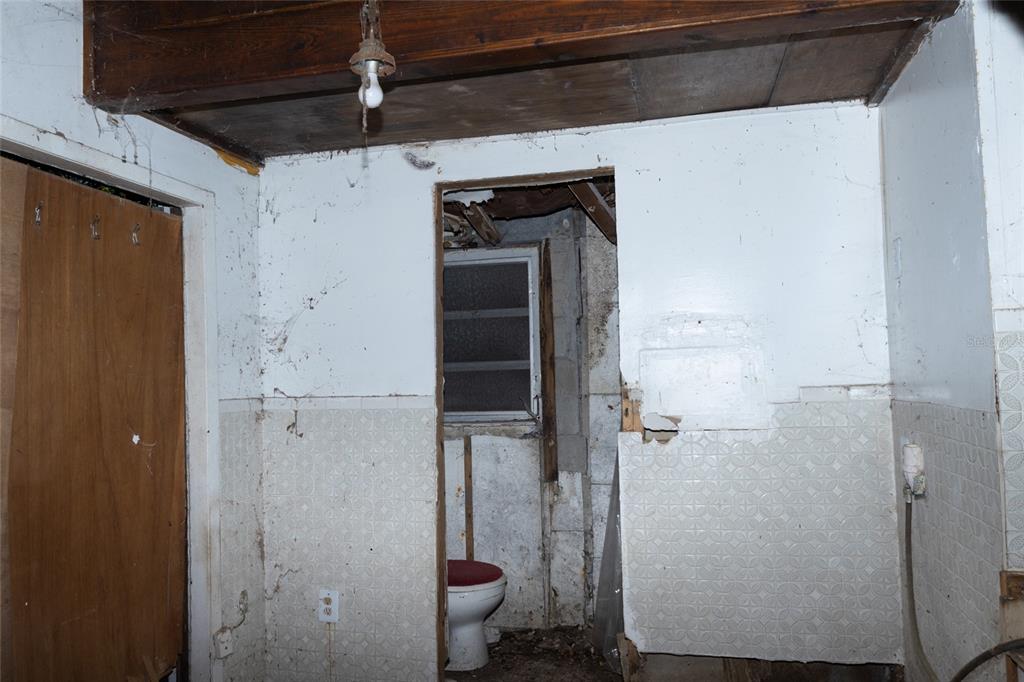 4711 Rio Grande Avenue Orlando, FL 32839 - Photo 24 of 38 a bathroom with a shower and toilet