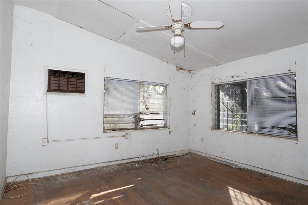 4711 Rio Grande Avenue Orlando, FL 32839 - Photo 36 of 38 an empty room with windows and fan