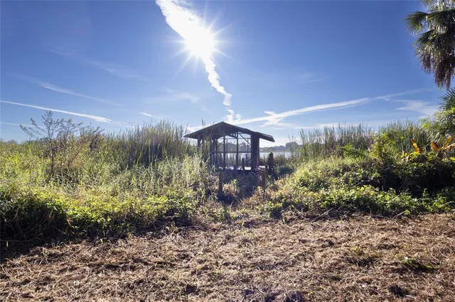 a view of a pathway both side of grassy field