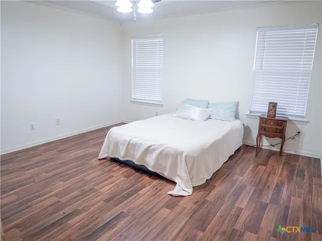 a bedroom with a bed and a table