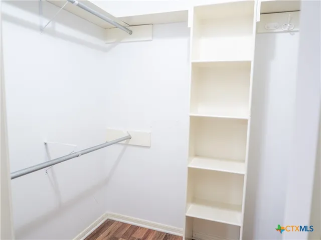 a view of an empty walk in closet