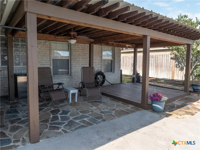 a view of a porch with chairs and floor